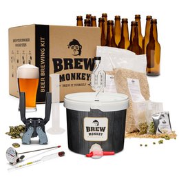 Brew Monkey beer brewing kit with amber bottles, black and white bucket, glass, hops, grains, brewing tools included.