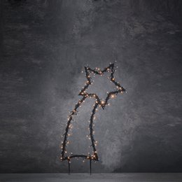 A tall, black metal garden plug with warm white LED lighting in the shape of a shooting star. The plug measures 35 cm in length and 77 cm in height.