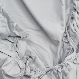 Stone 500TC sateen sheet set in light gray color. Includes fitted sheet, flat sheet, and various size options. Made of high-quality sateen material for a soft and luxurious feel.