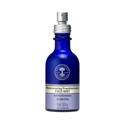 A hydrating facial mist with frankincense, a soothing and rejuvenating botanical ingredient. The blue glass bottle with a silver spray top gives the product a premium, natural appearance.