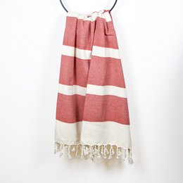 Organic cotton hammam towel in red and white striped pattern, suitable for use in the bathroom or as a beach towel.