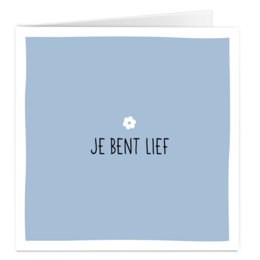 A greeting card with the text "Je bent lief" (You are sweet) and a small flower icon.