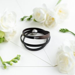 Ebony bracelet with a sleek, minimalist design. Features a black and white striped pattern for a modern, stylish look. Suitable for casual or formal wear.