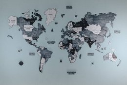 Gray wooden world map wall art puzzle with country labels and geographic divisions for home decor.