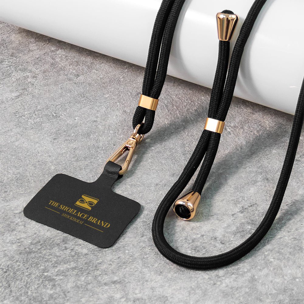 Universelle mobile bands i sort og guld
