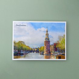 A postcard depicting the Munttoren, a historic tower in Amsterdam, Netherlands. The image shows a colorful, scenic view of the tower and surrounding canal with boats.