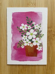 A bouquet of white daisies in a terra cotta pot against a vibrant pink background, creating a cheerful and floral birthday card design.