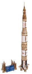 "NASA Saturn V rocket model, tan and blue, tall cylindrical space craft, detailed construction kit"