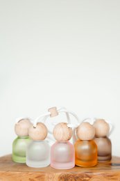 Fragrant reed diffuser in various scents including rose, chocolate, fresh linen, rhubarb, sea salt, vanilla, and floral garden.