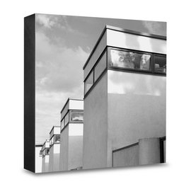 Black and white image of modern architectural building with geometric shapes and patterns.
