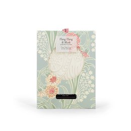  Floral reed diffuser with ylang-ylang and musk scent, featuring a decorative label with a nature-inspired design.