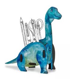 A blue and green dinosaur-shaped pen holder with various office supplies inside.