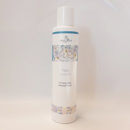 Coconut oil massage product with tiare scent, 150ml bottle, made with natural ingredients.