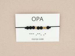 Morse code bracelet with black, silver, and bronze beads representing a meaningful message for grandpa.