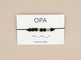Morse code bracelet with black, silver, and bronze beads representing a meaningful message for grandpa.