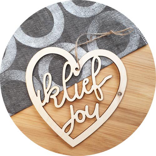 Wooden love heart with texts. "I'm on you" and "I love you".