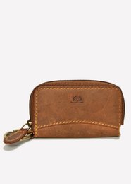 Vintage leather zippered key bag with a brown leather exterior, zipper closure, and metal hardware. Suitable for storing and organizing keys.