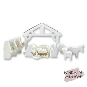 Small nativity scene made of white/gold ceramic plaster