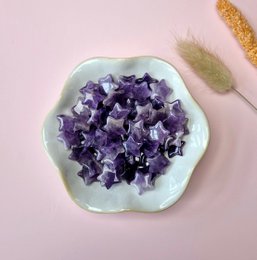 Small amethyst crystal stars in a light purple color.
