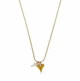 Gold-colored heart-shaped pendant necklace with chain.