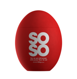 A red salt shaker with the text "SOSO - Seasalt Chili power - rood" printed on it. The salt shaker has a round, egg-shaped design.