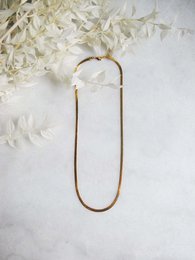 Thin gold-toned chain necklace with a simple, minimalist design. Suitable for everyday wear.
