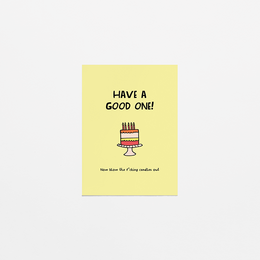 A colorful birthday card with a simple illustration of a birthday cake and the text "Have a good one!". The card is accompanied by a shopping voucher.