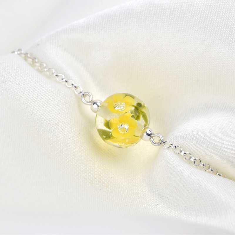 Essential Armband mit goldenen Glasknöpfen