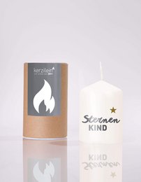 White pillar candle with flame design, "STAR CHILD" text, gold star accent, 6cm diameter.