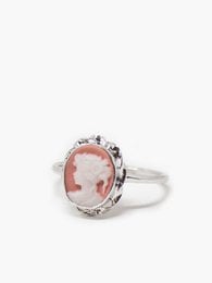 A delicate pink cameo ring with a sterling silver or 18-karat gold-plated silver setting, available in multiple sizes.