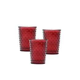  Cranberry-colored hobnail votive candle holder with a textured glass surface.