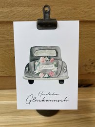 Postcard congratulations (wedding) - A charming illustration of a vintage car decorated with flowers, perfect for a wedding congratulations card.