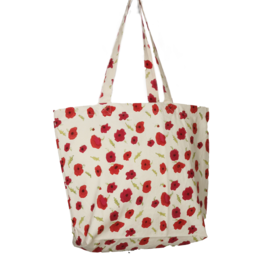  A large, reusable shopping bag with a repeating pattern of red poppies on a light background. The bag has sturdy handles and a simple, stylish design.