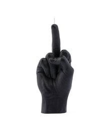 A black candle in the shape of a raised middle finger, packaged in a minimalist white box.