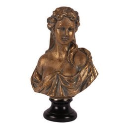 Resin bust statue of a female figure with intricate details and a flowing, draped garment. The statue has a warm, bronze-like finish and stands on a black base.