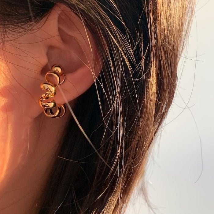 Pièce à oreille de conception de fil unique