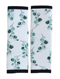 Padded belt pads in a white fabric with a delicate green floral print. The pads are designed for use with prams or strollers, providing extra comfort and support.
