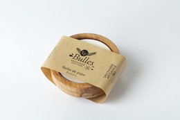 Cotton candy scented shaving soap with a round, wooden container.
