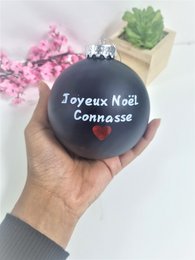 Ornament with the text "Joyeux Noël Connasse" in a black bauble.