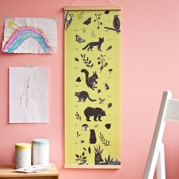 This poster features a variety of forest animals including foxes, owls, and other wildlife silhouettes against a bright green background. The poster would be suitable for a child's room or nursery decor.