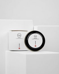 Black circular shoe polish container with The Shine branding. Includes a dial indicator for shine level.