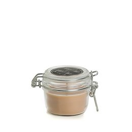 Beige skin-colored wax candle jar with glass lid and metal clasp closure, round cylindrical shape, set of 6 tealights.