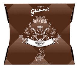 Caramel popcorn coated in milk chocolate, 30g pack. Sweet and indulgent snack.