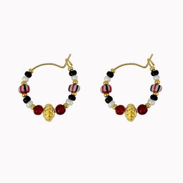 Hoop earrings with various beads in a mix of colors including red, black, and gold. The earrings have a circular shape and a mix of different bead types and sizes.