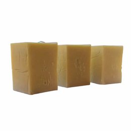 Marseille laundry soap bars, natural golden brown color, square shape, traditional French cleaning product.