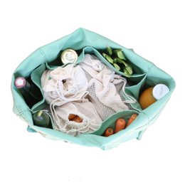 A large, reusable tote bag in a mint green color with the text "Small Acts Change the World" printed on it. The bag appears to be made of a durable, canvas-like material and has a roomy interior that could be used for grocery shopping, carrying items, or as an everyday reusable bag.