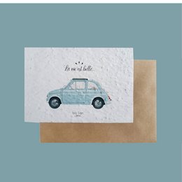 Plantable card with a whimsical illustration of a vintage car in a soft blue color. The card has a simple, handwritten-style text that says "Life is beautiful".