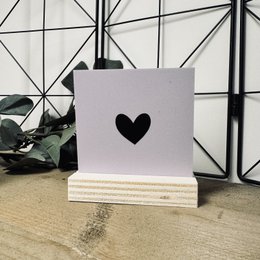 Decorative tile with black heart shape, available in dusty rose, dusty blue, pale orange, mustard, lavender, multiple colors