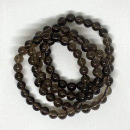 Smoke quartz lithotherapy bracelet in various sizes, featuring round, smooth beads in shades of gray and brown.