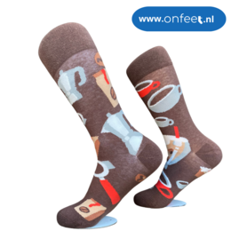 Brown socks with abstract geometric patterns in various colors.